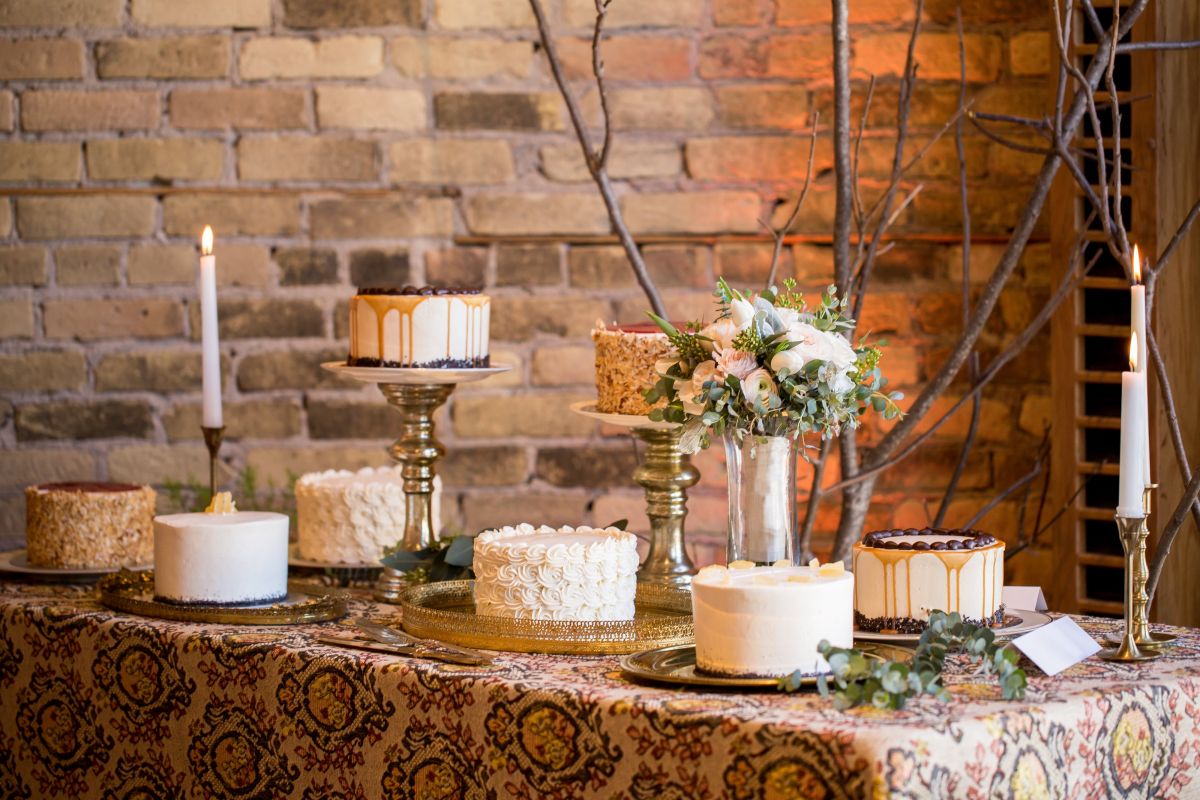 An array of cakes for a wedding from Nichole's Fine Pastry, Fargo, ND - photo credit Abby Anderson